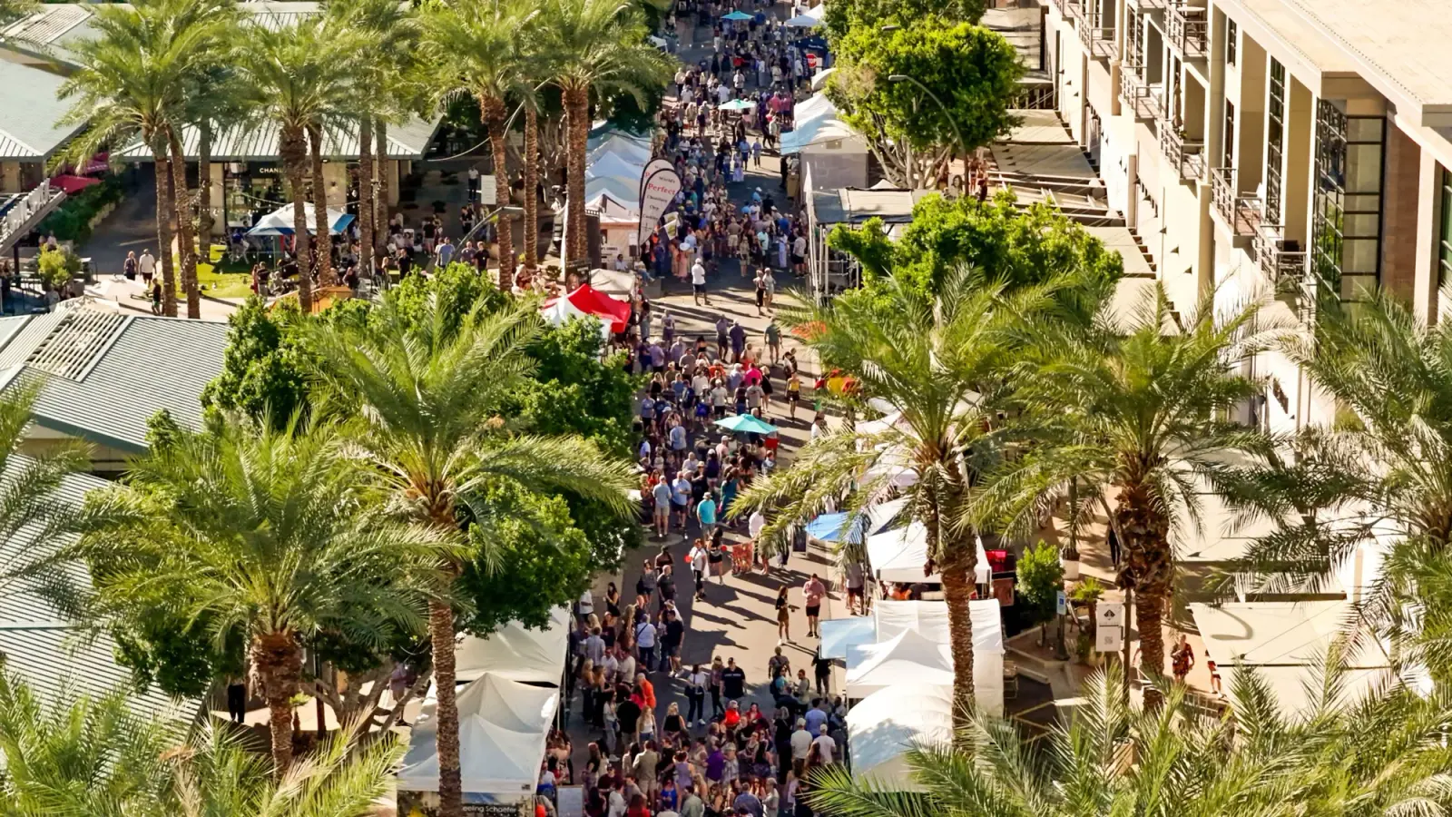 Aerial view of art booths, visitors and palm-lined streets at Kierland Commons in Scottsdale, Arizona